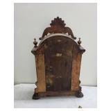 Ornate Wood Mantel Clock With Pendulum & Figural Accents