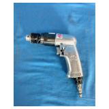 Mac Tools AD540 3/8' reversible air drill, featuring an aluminum housing and a keyed chuck