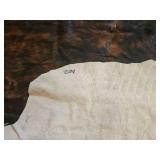 Large Dark Brown and White Cowhide Area Rug