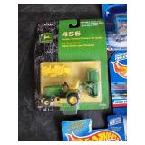 Lot of hotwheels and one john deere still in packages