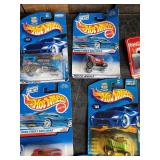 Lot of hotwheels and one john deere still in packages