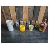 Lot of Disney and other drinking glasses of various styles