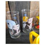 Lot of Disney and other drinking glasses of various styles