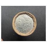 Unopened 20 coin roll of Morgan silver dollars with an 1893 at one end and a CC at the other end