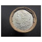 Unopened 20 coin roll of Morgan silver dollars with an 1893 at one end and a CC at the other end