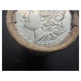 Unopened 20 coin roll of Morgan silver dollars with an 1893 at one end and a CC at the other end