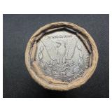 Unopened 20 coin roll of Morgan silver dollars with an 1893 at one end and a CC at the other end