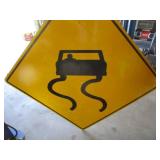 Decomm. Slippery Road Sign