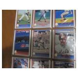Double sided page of baseball cards including an assortment of years and players