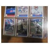 Double sided page of baseball cards including an assortment of years and players
