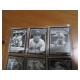Double sided page of baseball cards including an assortment of years and players