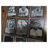 Double sided page of baseball cards including an assortment of years and players