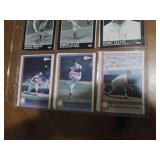 Double sided page of baseball cards including an assortment of years and players