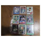 Double sided page of sports cards including Cal Ripken, Wade Boggs, Mark McGuire, Darryl Strawberry, Jose Canseco and others