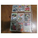Double sided page of sports cards including Cal Ripken, Wade Boggs, Mark McGuire, Darryl Strawberry, Jose Canseco and others