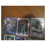 Double sided page of sports cards including Cal Ripken, Wade Boggs, Mark McGuire, Darryl Strawberry, Jose Canseco and others