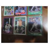 Double sided page of sports cards including Cal Ripken, Wade Boggs, Mark McGuire, Darryl Strawberry, Jose Canseco and others