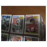 Double sided page of sports cards including Cal Ripken, Wade Boggs, Mark McGuire, Darryl Strawberry, Jose Canseco and others