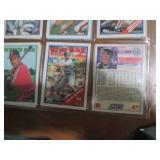 Double sided page of sports cards including Cal Ripken, Wade Boggs, Mark McGuire, Darryl Strawberry, Jose Canseco and others