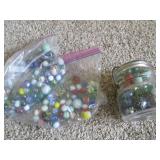 Lidded jar and bag of vintage marbl...