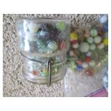 Lidded jar and bag of vintage marbl...