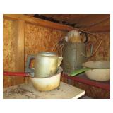 Metal pitchers and pans, hanging wo...