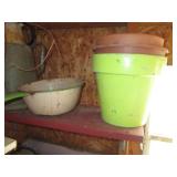 Metal pitchers and pans, hanging wo...