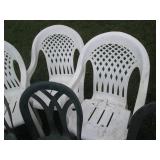 Outdoor patio chairs in green and w...