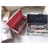 Bundle of empty metal toolboxes in ...