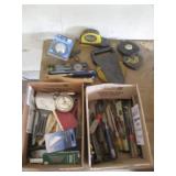 Variety of tape measures, levels, c...