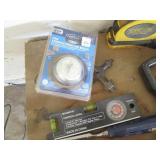 Variety of tape measures, levels, c...