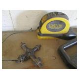 Variety of tape measures, levels, c...