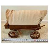 Vintage miniature wooden covered wagon with celluloid people toy display