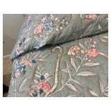 Vintage French Provincial style twin bed, dark wood frame with a cushioned, light green floral upholstered headboard