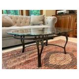 Wrought iron oval coffee table with beveled glass top