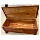 Cedar wood chest with brass corner hardware and ornate details