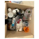 Various paper plates, plastic cups, party supplies