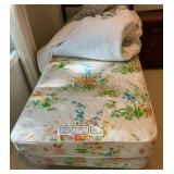 Vintage French Provincial style twin bed, dark wood frame with a cushioned, light green floral upholstered headboard