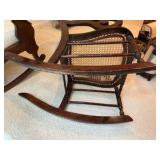 Vintage rocking chair cherry wood framed, light colored woven cane back and seat