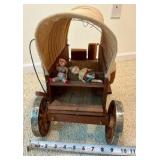 Vintage miniature wooden covered wagon with celluloid people toy display