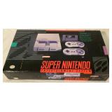 Super Ninetendo Entertainment System (SNES) - Console, Two Controllers and Super Mario Would Game