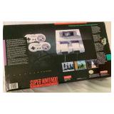 Super Ninetendo Entertainment System (SNES) - Console, Two Controllers and Super Mario Would Game