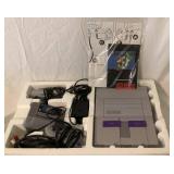 Super Ninetendo Entertainment System (SNES) - Console, Two Controllers and Super Mario Would Game