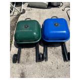 Portable charcoal grills, one green and one blue