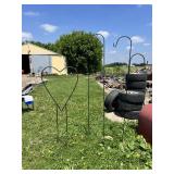 Large metal heart-shaped garden stake and three shepherd