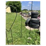 Large metal heart-shaped garden stake and three shepherd