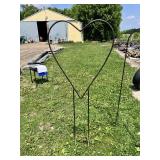 Large metal heart-shaped garden stake and three shepherd