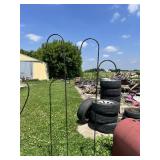 Large metal heart-shaped garden stake and three shepherd
