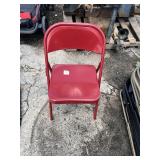 Stack of Metal Folding Chairs