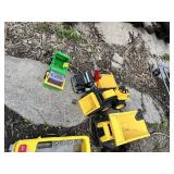 Toy vehicles including trucks, school bus, and toy dump trucks
